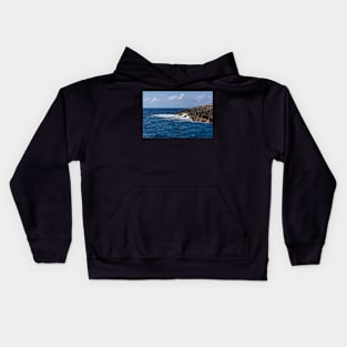 Waves beating against the rocks Kids Hoodie